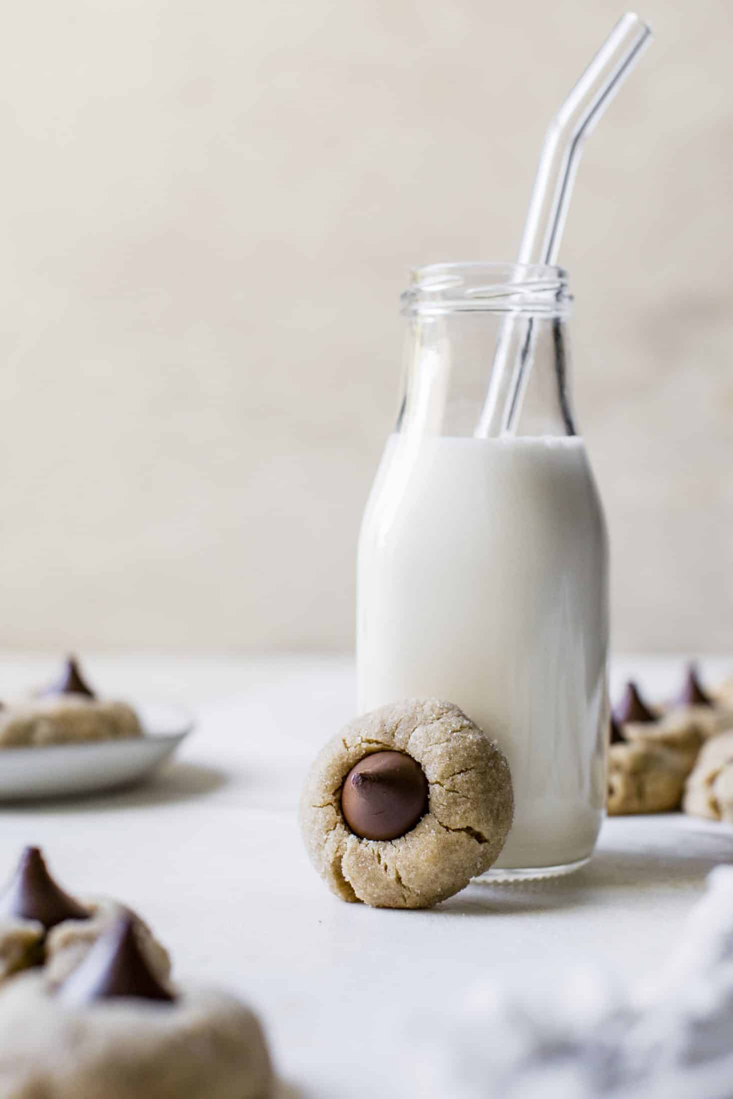 These are perfect peanut butter blossoms! My favorite cookie at christmastime has always been classic peanut butter blossoms and my grandma had the recipe nailed. These are super easy, delicious and will make a lot of cookies! I howsweeteats.com #peanutbutter #blossoms