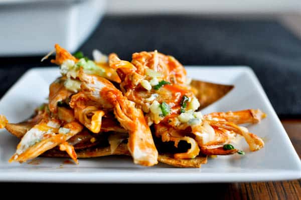 Layered Baked Buffalo Chicken Nachos I howsweeteats.com Layered Baked Buffalo Chicken Nachos I howsweeteats.com