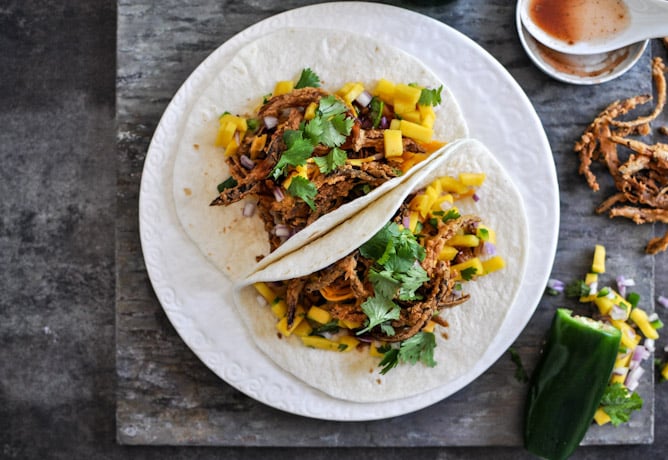 Crockpot BBQ Beer Pulled Pork Tacos with Crispy Onion Straws and Mango Salsa I howsweeteats.com Crockpot BBQ Beer Pulled Pork Tacos with Crispy Onion Straws and Mango Salsa I howsweeteats.com