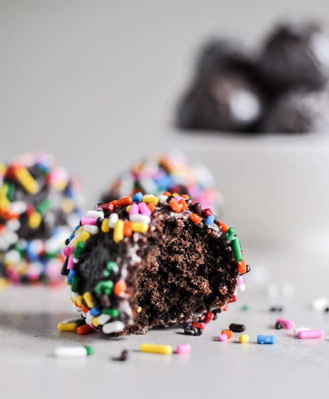 Glazed and Sprinkled Chocolate Cake Donut Holes I howsweeteats.com Glazed and Sprinkled Chocolate Cake Donut Holes I howsweeteats.com