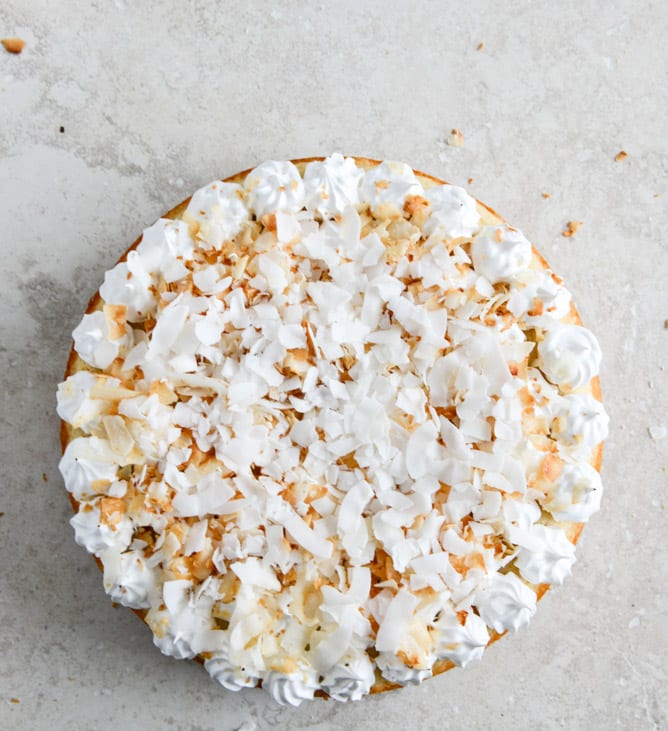 Easy Lemon Cake with Marshmallow Frosting + Toasted Coconut I howsweeteats.com Easy Lemon Cake with Marshmallow Frosting + Toasted Coconut I howsweeteats.com