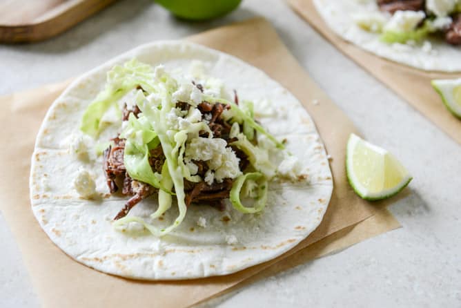 Crockpot Short Rib Tacos with Salted Lime Cabbage and Queso Fresco I howsweeteats.com Crockpot Short Rib Tacos with Salted Lime Cabbage and Queso Fresco I howsweeteats.com