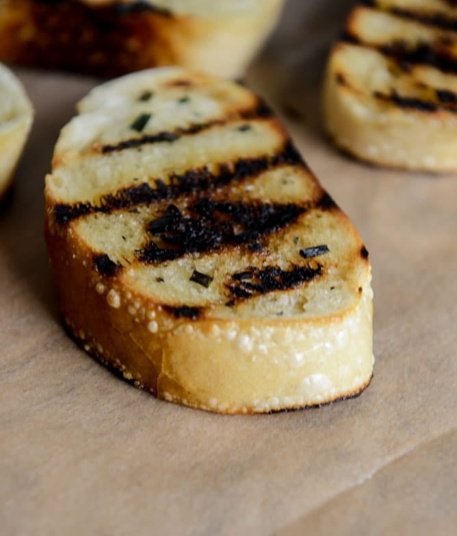 Grilled Sourdough with Buttery Herbs, Heirloom Tomatoes + a Honey Drizzle I howsweeteats.com Grilled Sourdough with Buttery Herbs, Heirloom Tomatoes + a Honey Drizzle I howsweeteats.com
