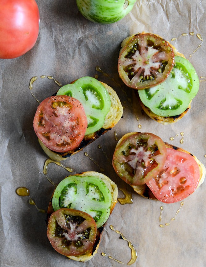 Grilled Sourdough with Buttery Herbs, Heirloom Tomatoes + a Honey Drizzle I howsweeteats.com Grilled Sourdough with Buttery Herbs, Heirloom Tomatoes + a Honey Drizzle I howsweeteats.com