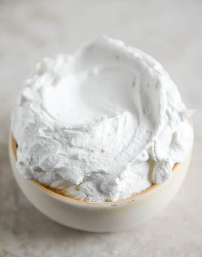 Dark Chocolate Chunk Popovers with Spiked Vanilla Bourbon Whipped Cream I howsweeteats.com Dark Chocolate Chunk Popovers with Spiked Vanilla Bourbon Whipped Cream I howsweeteats.com