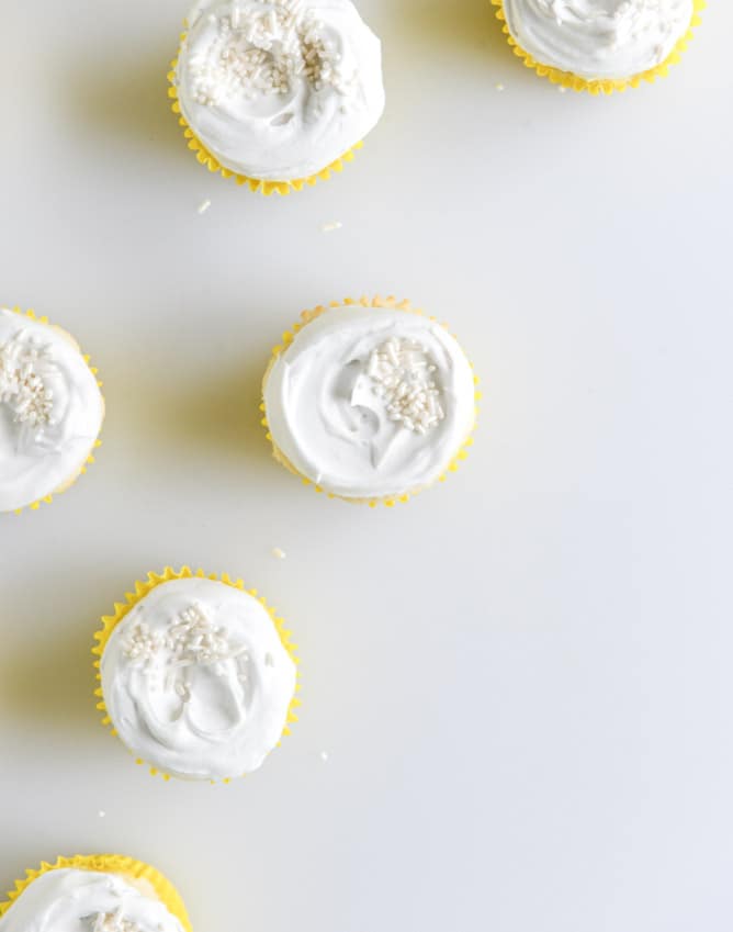 Fluffy Lemon Cupcakes with Whipped Coconut Cream I howsweeteats.com