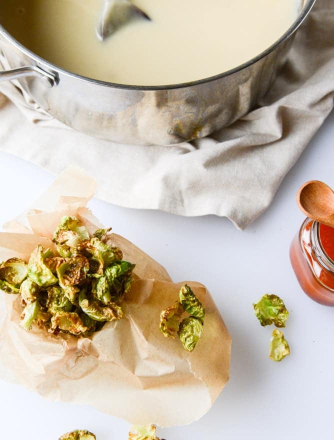 creamy roasted garlic potato soup with crispy brussels I howsweeteats.com
