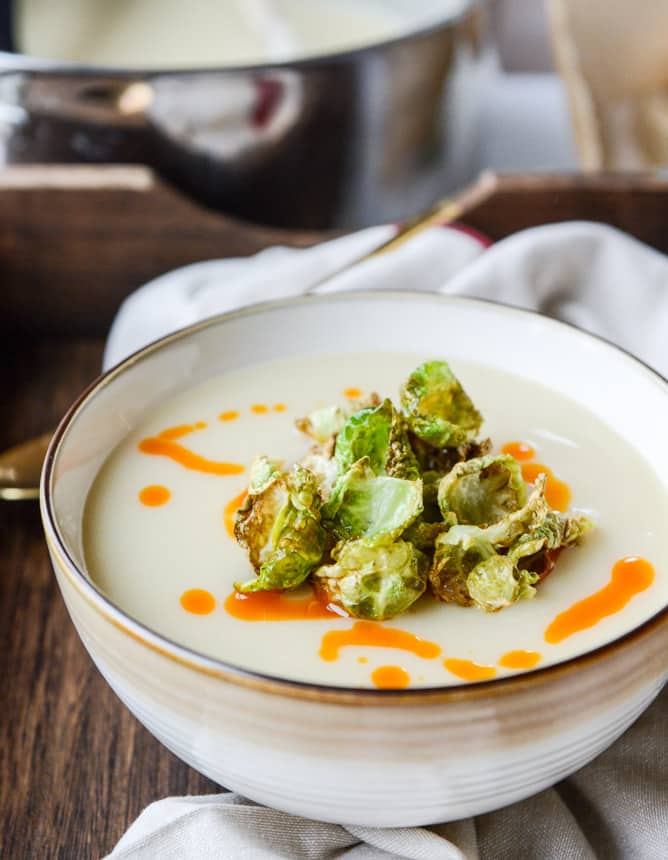 creamy roasted garlic potato soup with crispy brussels I howsweeteats.com