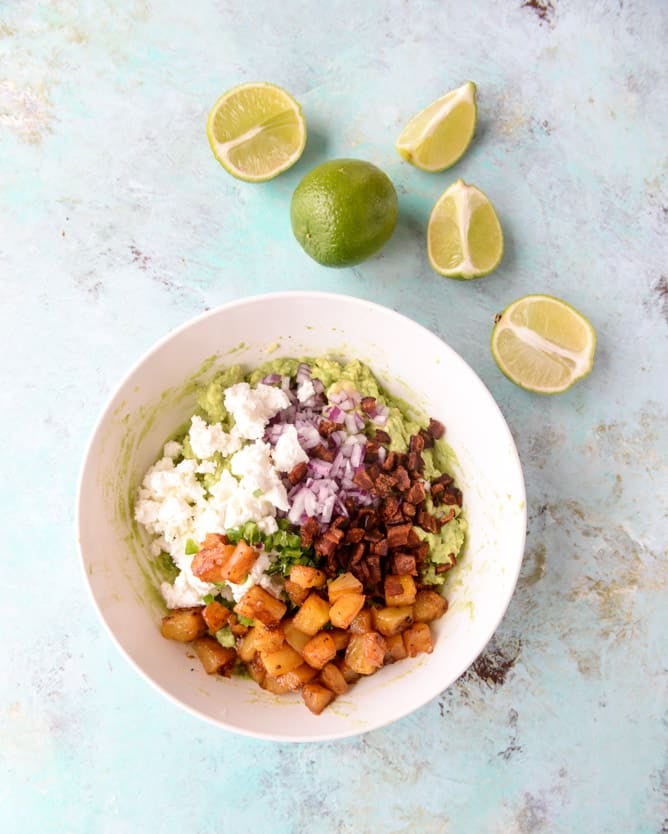 caramelized pineapple, bacon and goat cheese guacamole I howsweeteats.com
