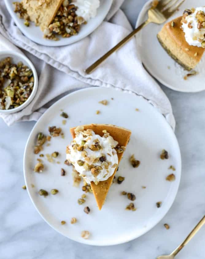 brown sugar pumpkin cheesecake with pistachio macaroon crust I howsweeteats.com