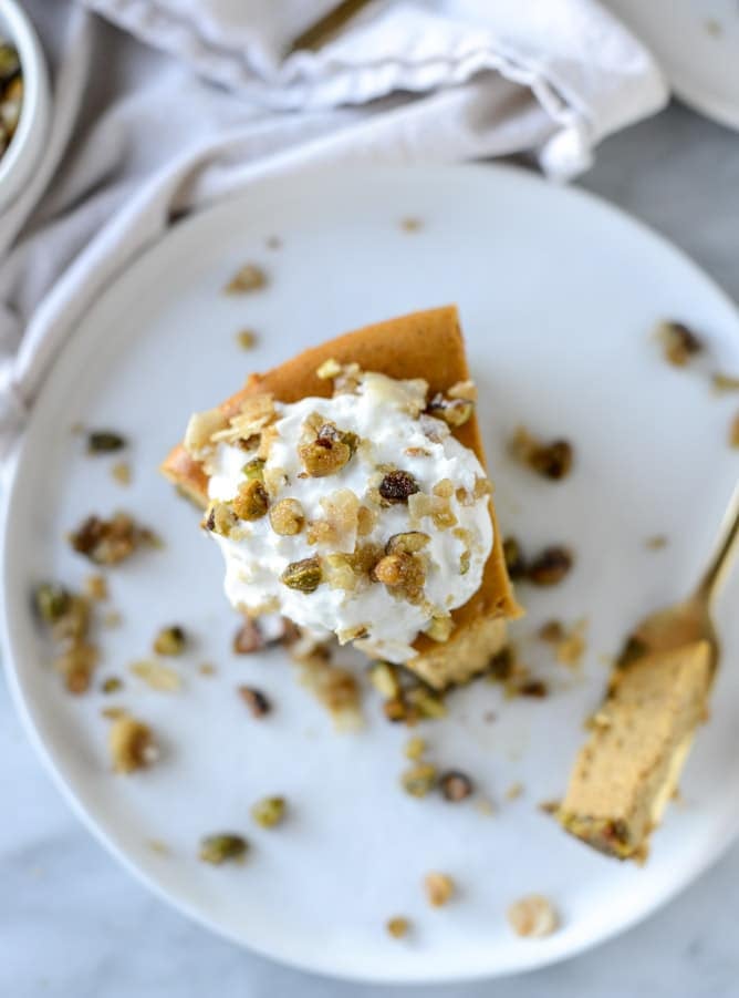 brown sugar pumpkin cheesecake with pistachio macaroon crust I howsweeteats.com
