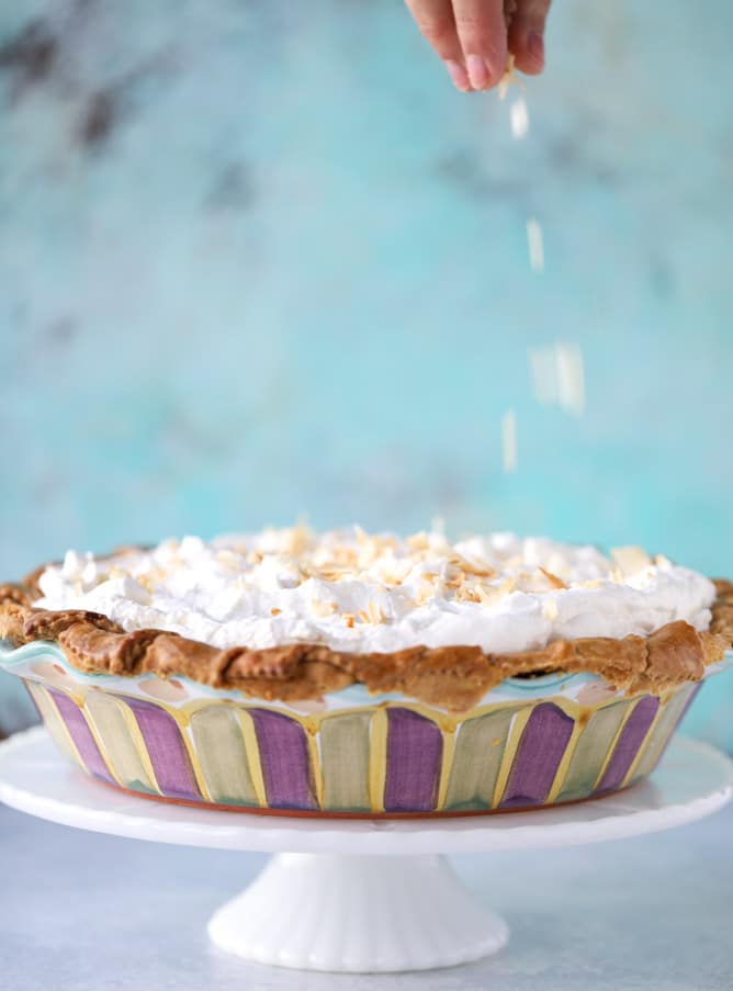 coconut custard pie with coconut whipped cream I howsweeteats.com