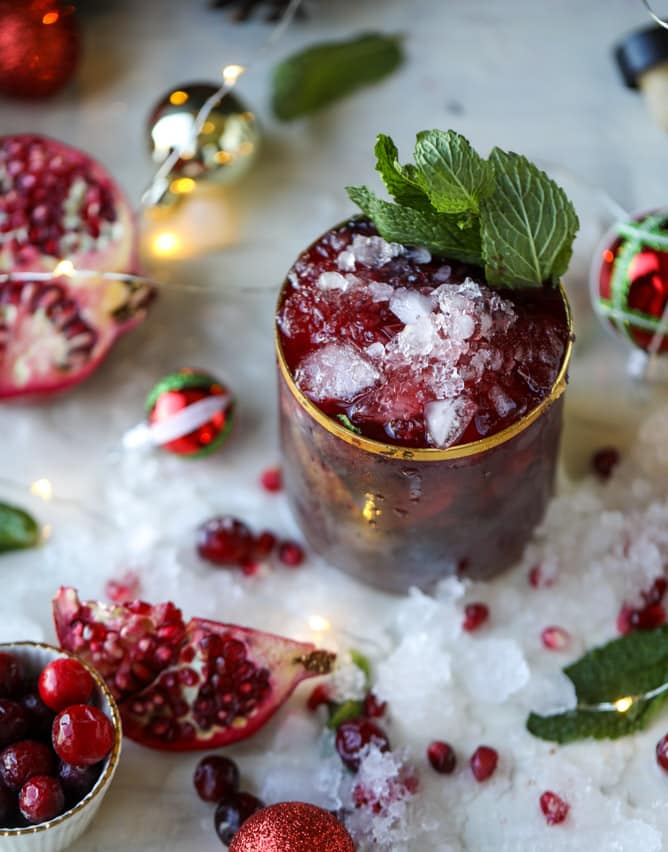 cranberry pomegranate juleps I howsweeteats.com #cocktails #christmas #cranberry #pomegranate #mintjulep