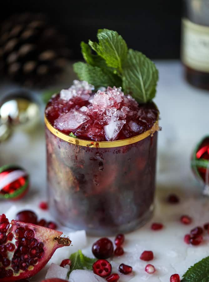 cranberry pomegranate juleps I howsweeteats.com #cocktails #christmas #cranberry #pomegranate #mintjulep