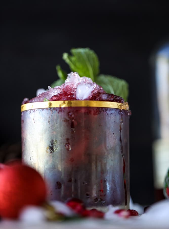 cranberry pomegranate juleps I howsweeteats.com #cocktails #christmas #cranberry #pomegranate #mintjulep