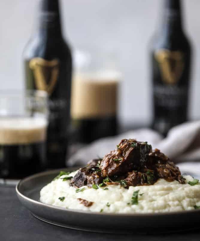 guinness short ribs with cheesy cauliflower mash I howsweeteats.com #slowcooker #guinness #shortribs #saintpatricksday #cauliflower