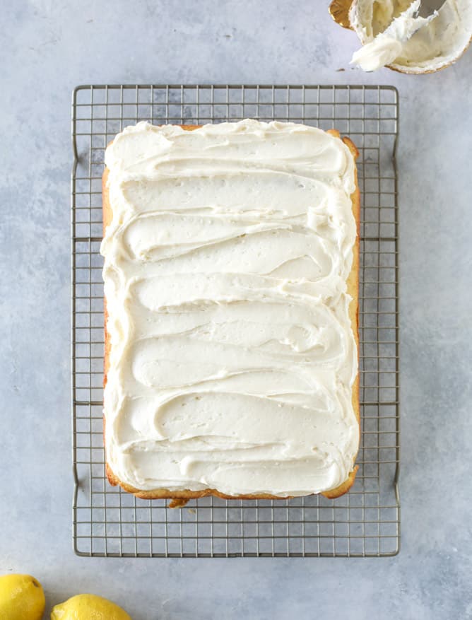lemon sheet cake with cream cheese frosting I howsweeteats.com #lemon #cake #sheetcake #dessert #creamcheesefrosting