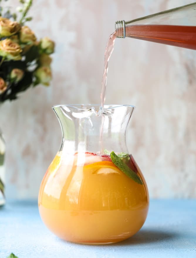 minted mimosa punch I howsweeteats.com #mimosa #punch #orangejuice #cocktails #champagne