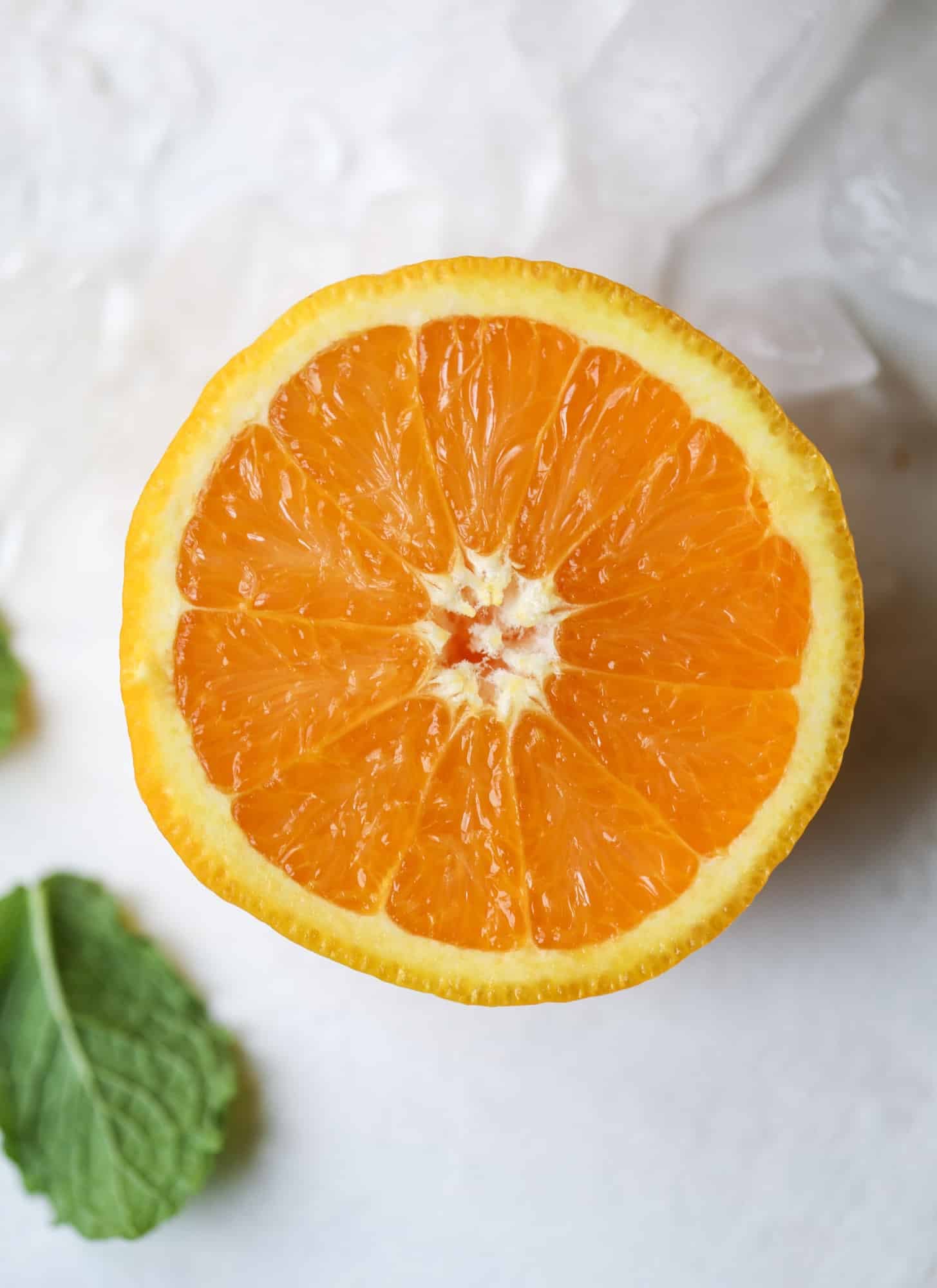 This orange crush is a copycat cocktail from the ones served in Ocean City, Maryland at the beach all summer long! It's one entire freshly squeezed orange with vodka and lemon lime soda and it tastes like heaven. Super refreshing and perfect for summer. I howsweeteats.com #orange #crush #cocktail #ocean #city #vodka