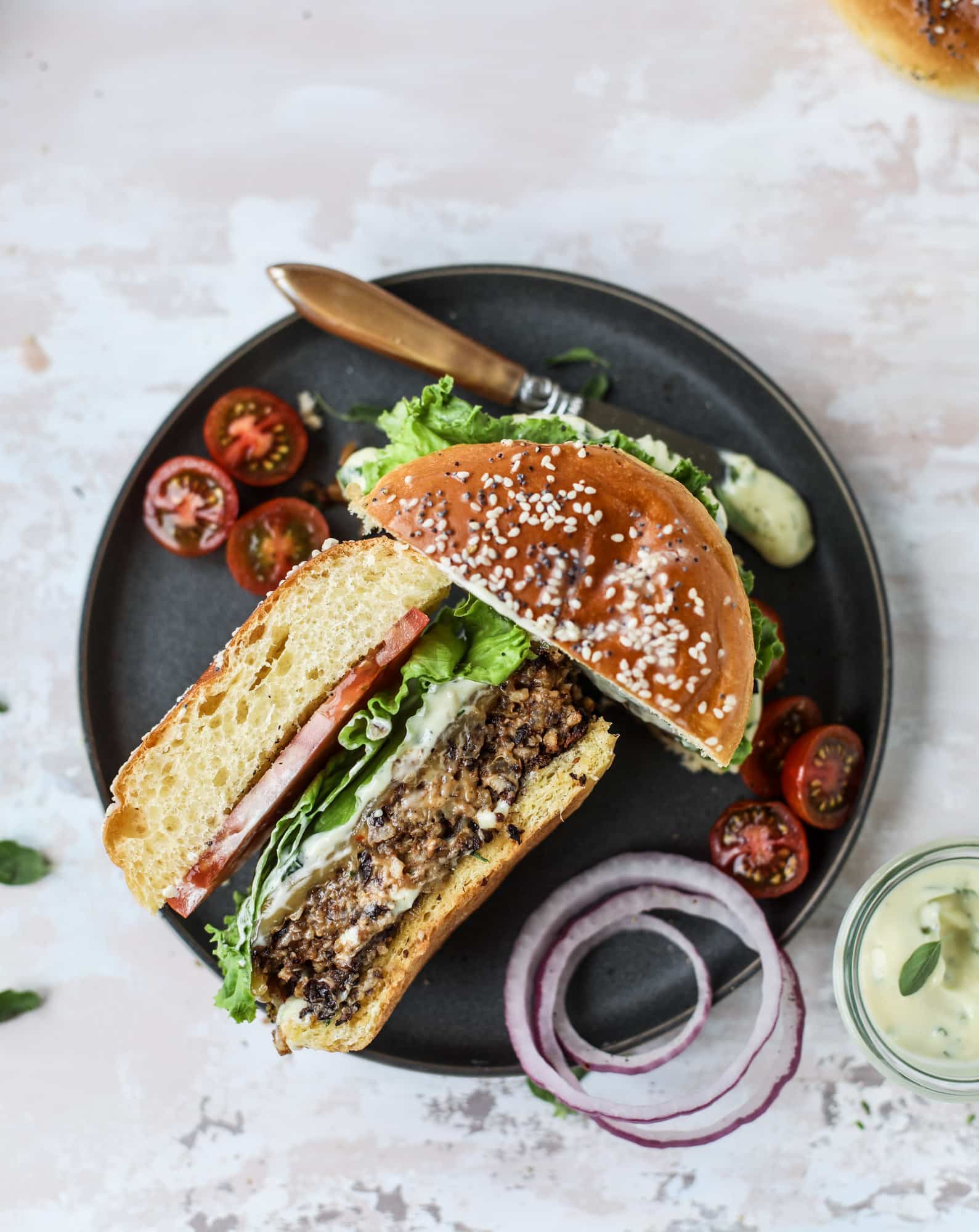 This is the best ever veggie burger and that is not an exaggeration! It's delicious, full of texture and chew, super satisfying and actually sticks together in the pan. You can serve it on buns, make a patty melt, a salad or lettuce wraps - perfection! I howsweeteats.com #best #veggie #burger #vegetarian #beans #quinoa