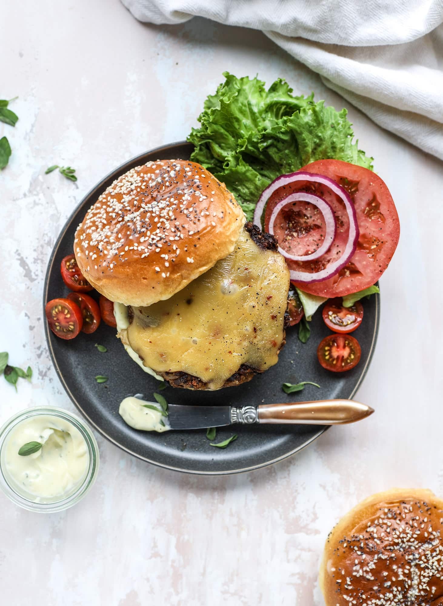 This is the best ever veggie burger and that is not an exaggeration! It's delicious, full of texture and chew, super satisfying and actually sticks together in the pan. You can serve it on buns, make a patty melt, a salad or lettuce wraps - perfection! I howsweeteats.com #best #veggie #burger #vegetarian #beans #quinoa