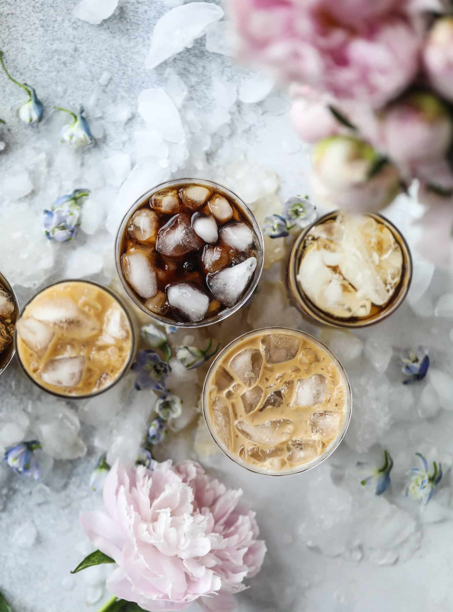 This iced coffee soda is so perfect for summer! Rich coconut syrup, cold brew coffee, cream (or coconut cream!) if you'd like it and lots of bubbly soda. Tastes refreshing, feels like a cocktail and still gives you a pick-me-up! I howsweeteats.com #iced #coffee #soda #coconut