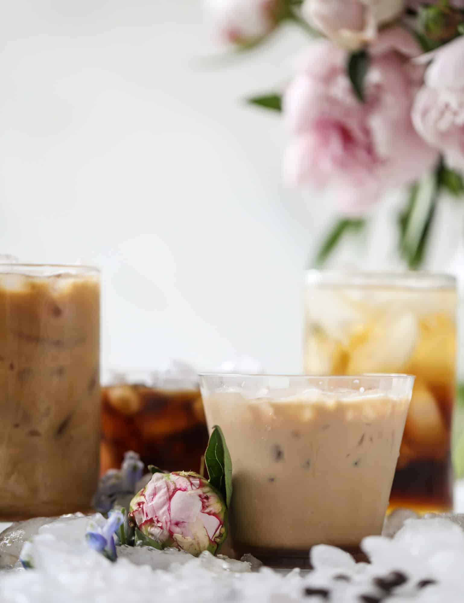 This iced coffee soda is so perfect for summer! Rich coconut syrup, cold brew coffee, cream (or coconut cream!) if you'd like it and lots of bubbly soda. Tastes refreshing, feels like a cocktail and still gives you a pick-me-up! I howsweeteats.com #iced #coffee #soda #coconut