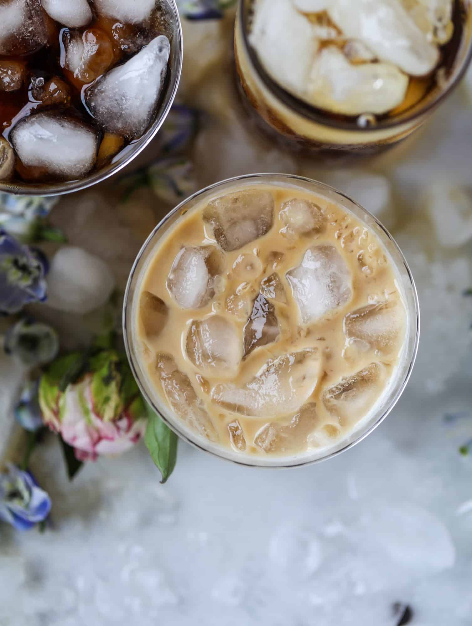 This iced coffee soda is so perfect for summer! Rich coconut syrup, cold brew coffee, cream (or coconut cream!) if you'd like it and lots of bubbly soda. Tastes refreshing, feels like a cocktail and still gives you a pick-me-up! I howsweeteats.com #iced #coffee #soda #coconut