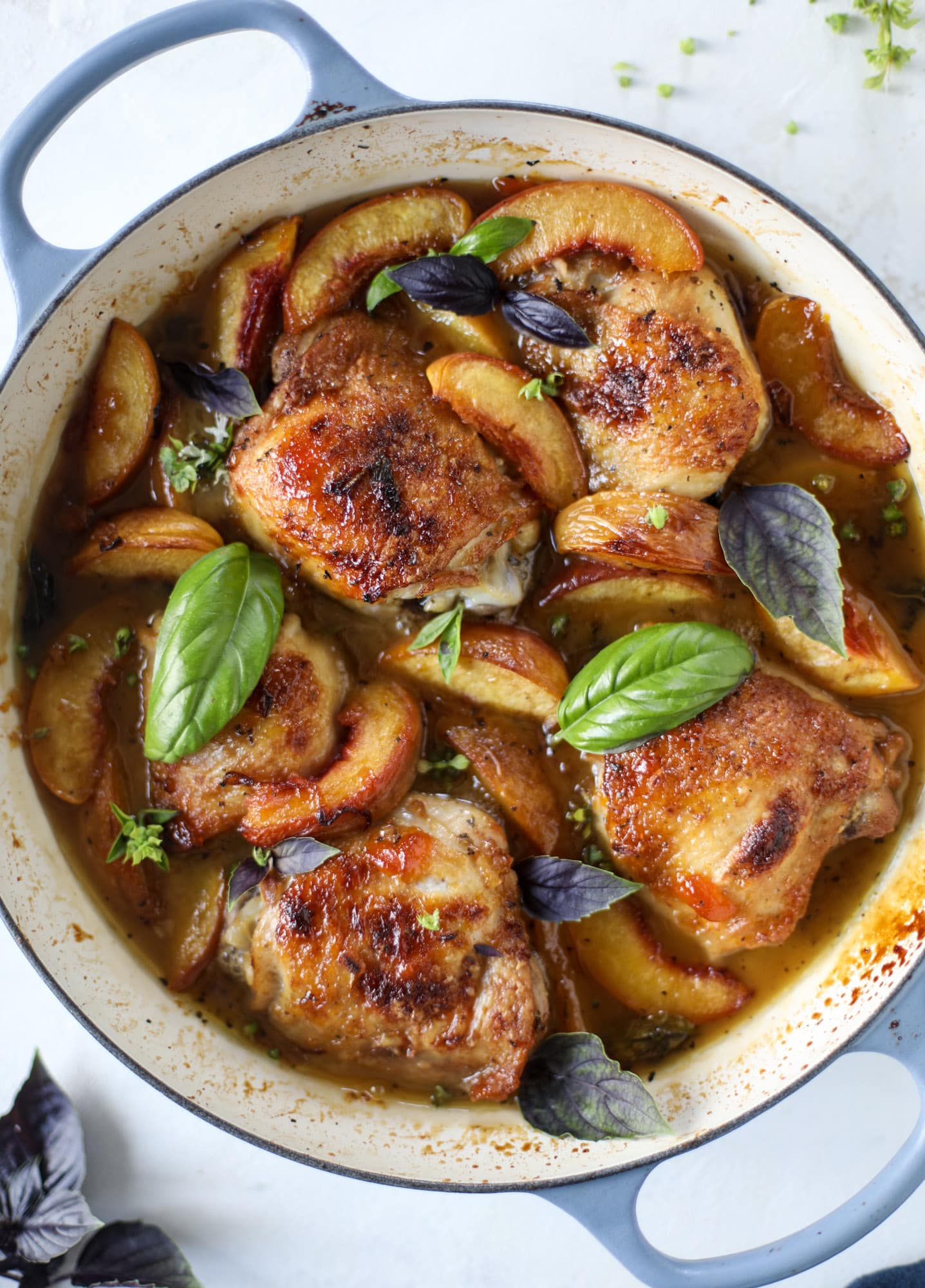 This amazing summertime one pot chicken is made with fresh peaches and basil and takes no time at all. The sweet and savory combination is perfect for a quick weeknight meal; the sauce is amazing for dipping and the chicken is flavorful as can be. I howsweeteats.com #chicken #peach #basil #easy #dinner #recipe #summer #healthy