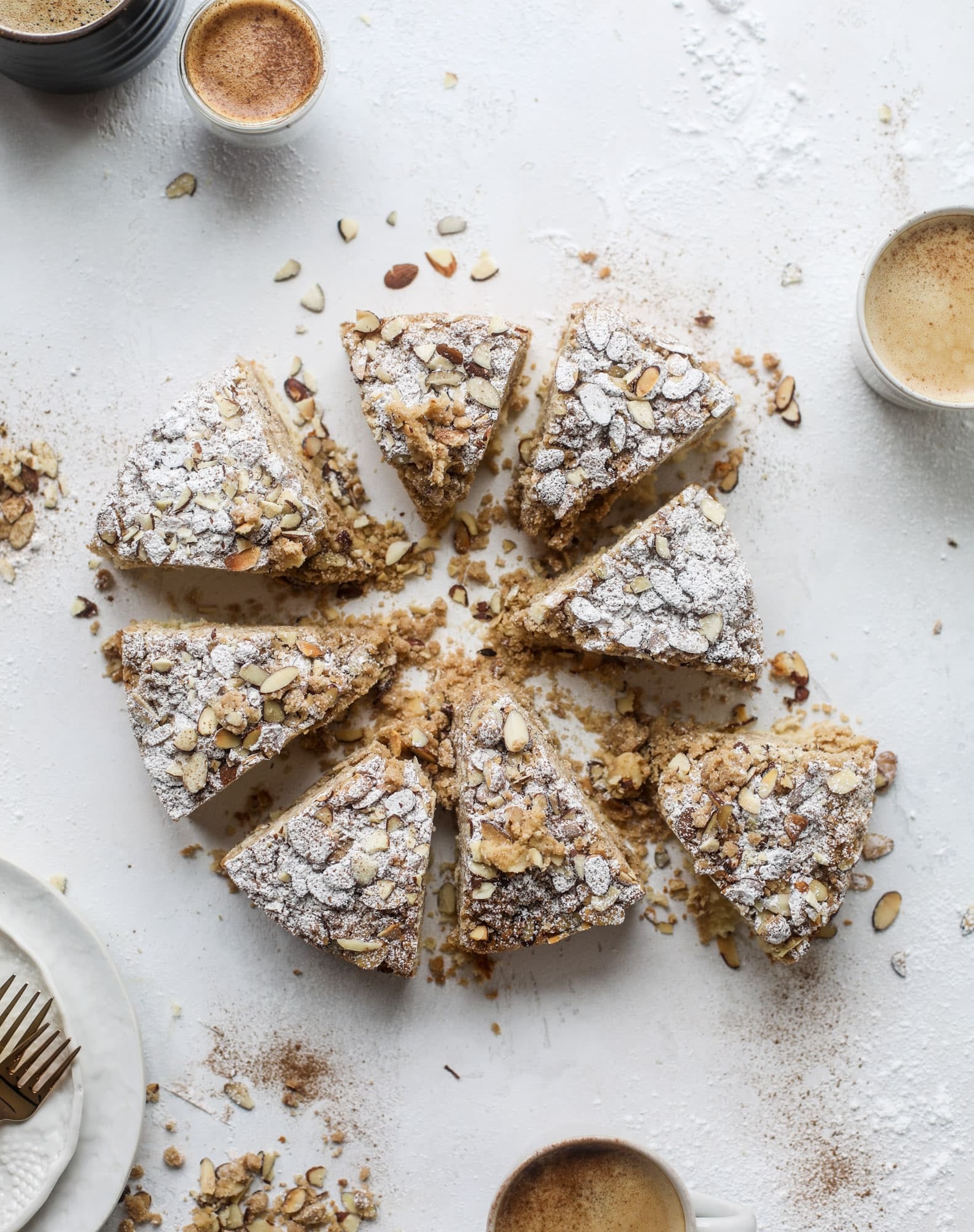This almond crumb cake is so delicious and perfect for breakfast or dessert! It's full of delicious almond flavor and crunch and the crumb on top is so thick and perfect. It's like an almond croissant on steroids. I howsweeteats.com #almond #crumb #cake