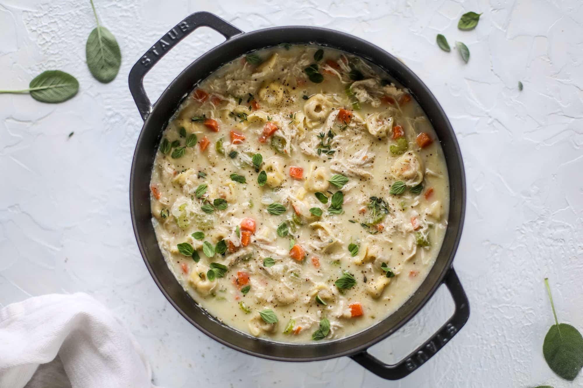 This creamy chicken tortellini soup is the perfect weeknight meal! It comes together quickly and is a great meal to use up a rotisserie chicken. It's satisfying and hearty, with tortellini replacing egg noodles for the pasta. Comfort food perfection! I howsweeteats.com #chicken #soup