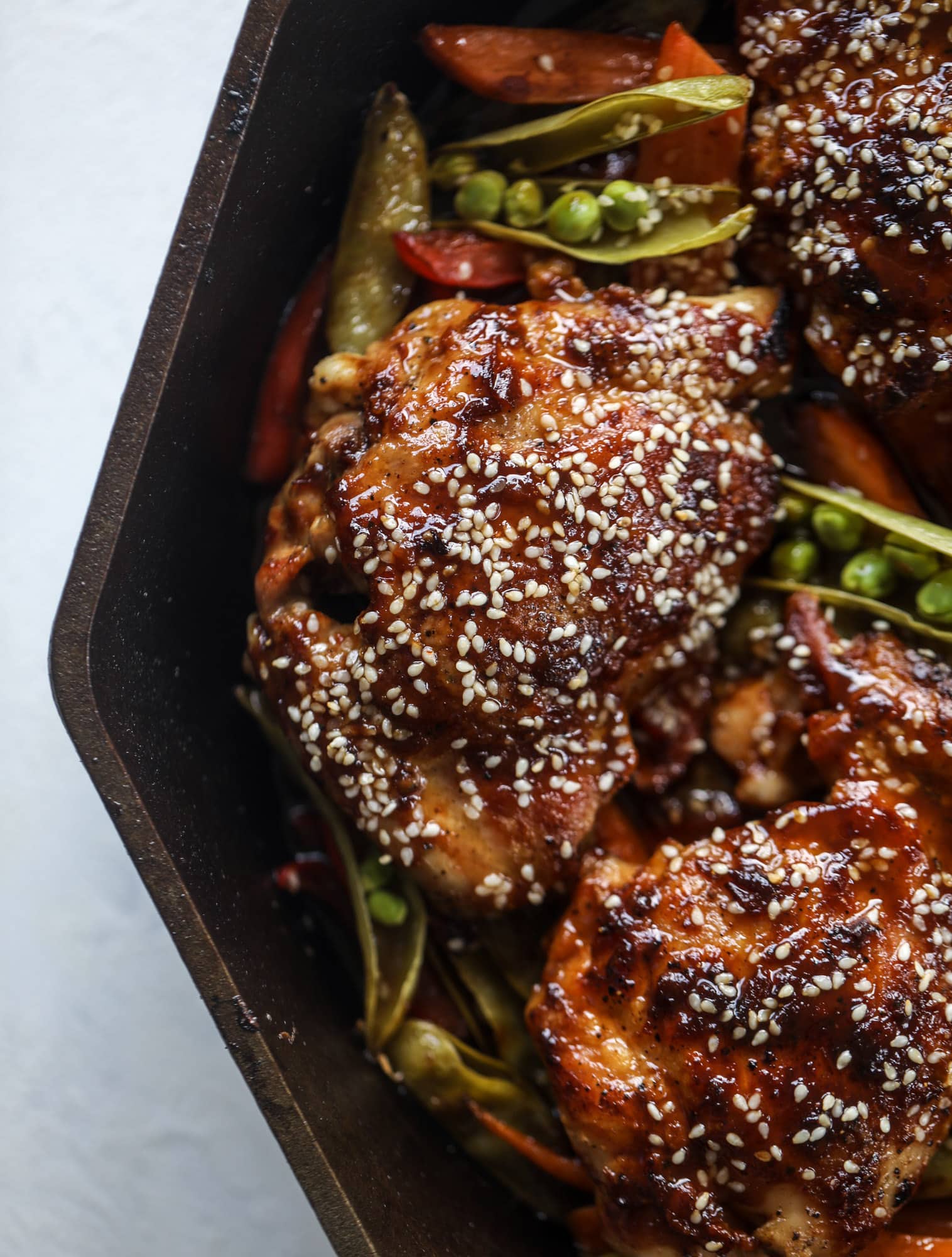 This one pan sesame chicken and veggies is so easy and delicious! It's the perfect weeknight meal that is packed with flavor. The chicken and veggies are great on their own but also wonderful when paired with brown rice or quinoa! I howsweeteats.com #one #pan #sesame #chicken #dinner #easy