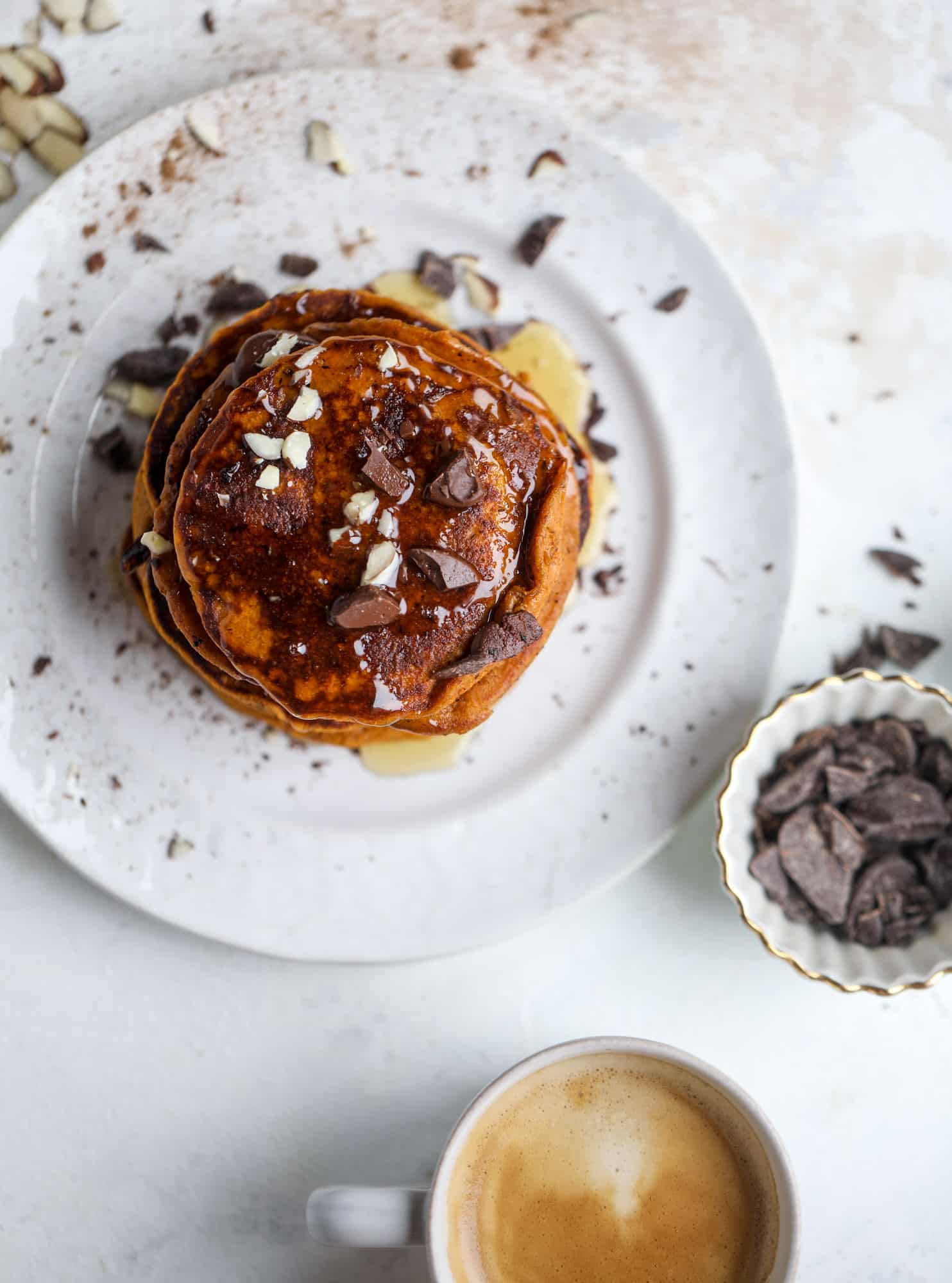 These pumpkin protein pancakes are packed with delicious ingredients to make a healthy and satisfying fall breakfast! They are super easy - you throw everything into a blender to create the most incredible protein pancakes! I howsweeteats.com #protein #pancakes #pumpkin #breakfast #fall