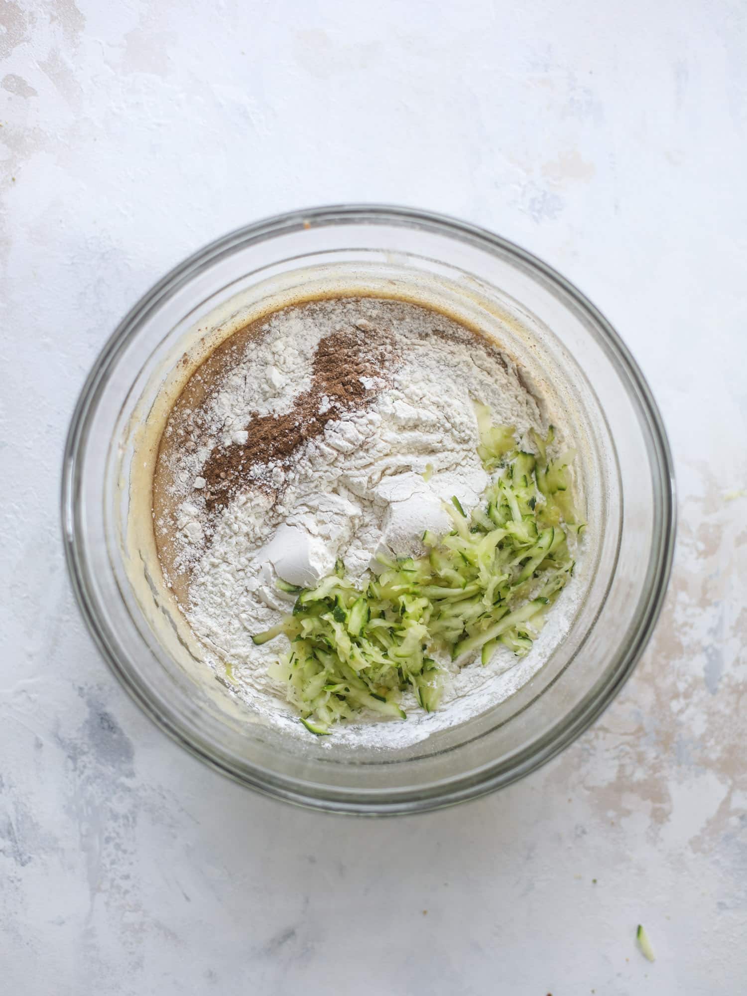 These zucchini bars with cream cheese icing are a fun twist on zucchini bread! Zucchini bars are super easy to make, have a little spice and a lot of flavor, topped with the creamiest cream cheese frosting. Delicious and simple! I howsweeteats.com #zucchini #bars #cream #cheese #icing #dessert