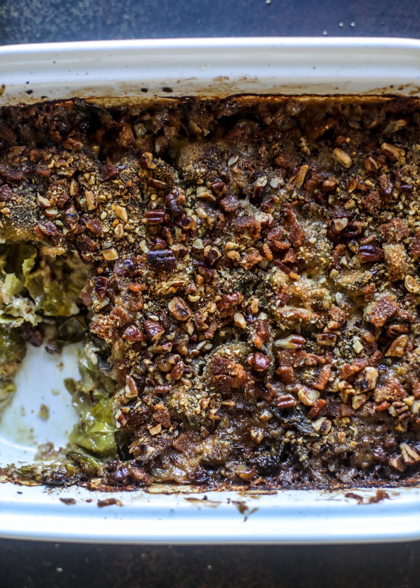 This brussels sprouts gratin is heaven in a dish! It's super flavorful, delicious and comes together to create a fabulous side dish for Thanksgiving or the holidays. Pancetta and cheese turn this in to flavor town - you won't be able to stop eating it! I howsweeteats.com #brusselssprouts #gratin