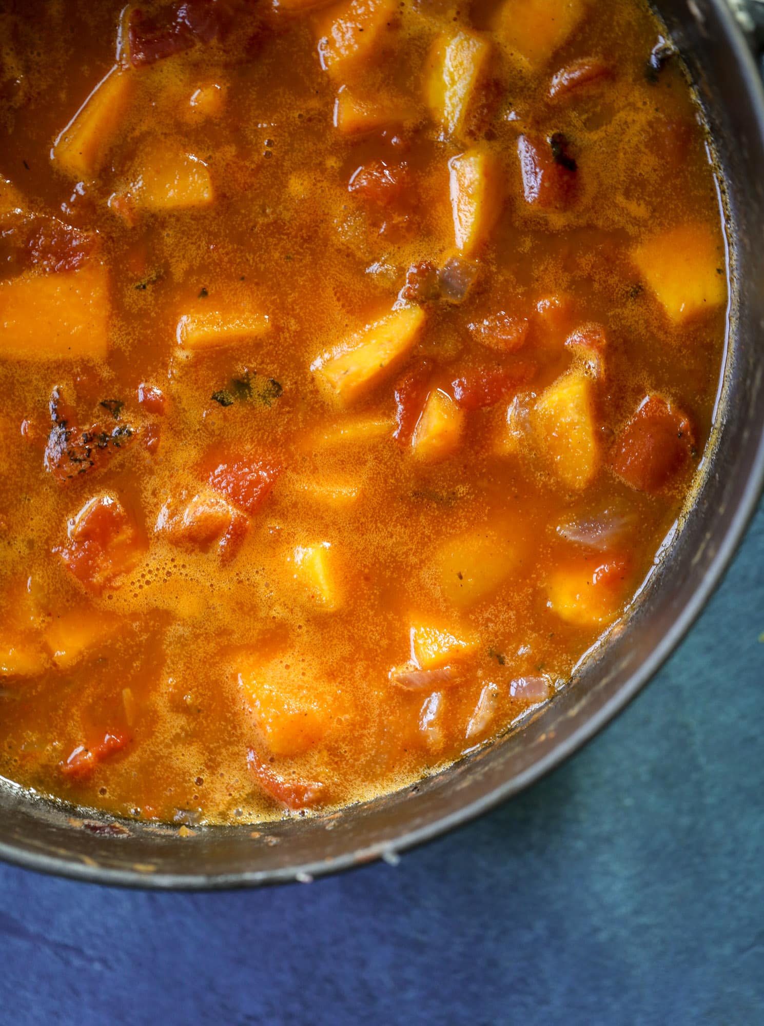 This butternut squash pasta sauce is heaven for an October dinner! Fire roasted tomatoes, butternut squash, pumpkin, sage, spice and parmesan all come together to create a delicious, simmered pot of sauce to blanket your favorite pasta! I howsweeteats.com #butternut #squash #pasta #sauce
