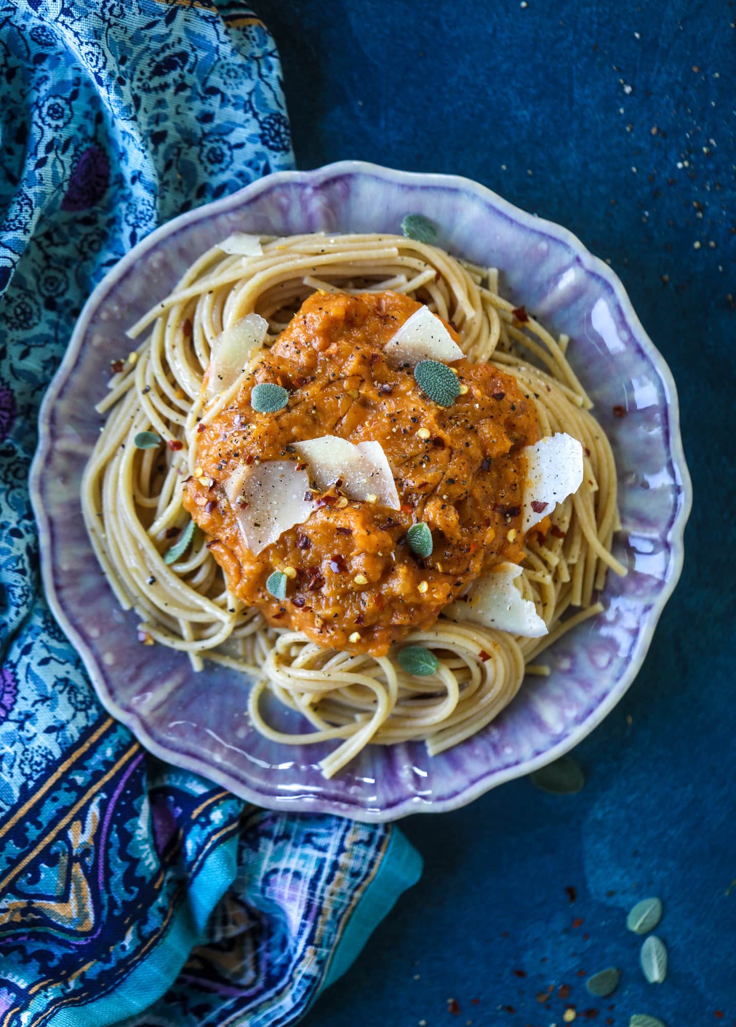 This butternut squash pasta sauce is heaven for an October dinner! Fire roasted tomatoes, butternut squash, pumpkin, sage, spice and parmesan all come together to create a delicious, simmered pot of sauce to blanket your favorite pasta! I howsweeteats.com #butternut #squash #pasta #sauce