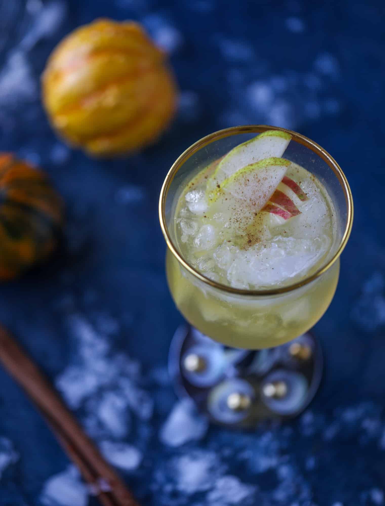 This pumpkin sangria is perfect for the fall and holiday season! A homemade pumpkin pie syrup gives the drink excellent flavor along with bubbles and apple cider and of course, boozy fruit. It's a favorite for Halloween or Thanksgiving! I howsweeteats.com #pumpkin #sangria