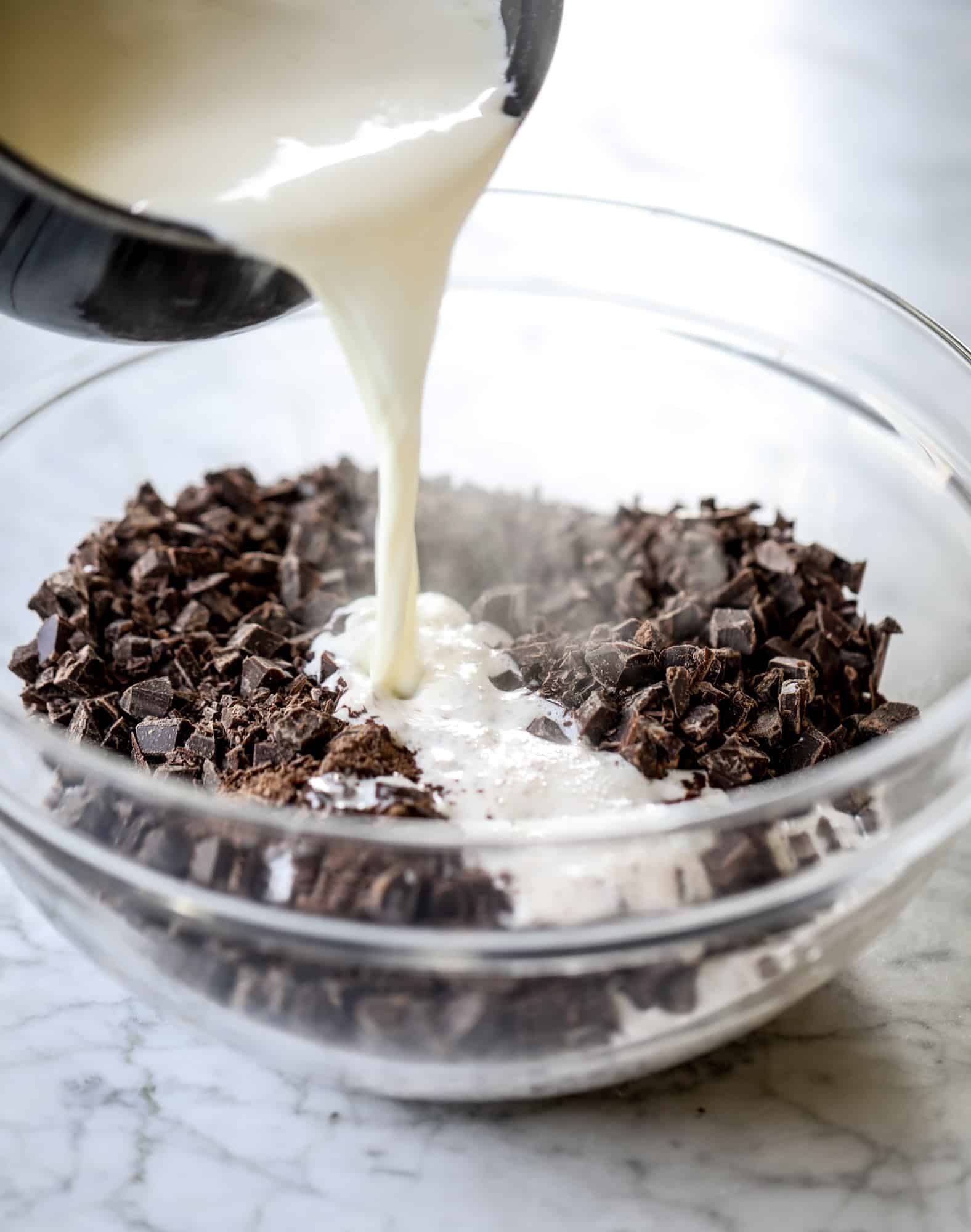 This salted dark chocolate stout cake is absolutely divine! It's ridiculously rich and perfect for a crowd or a party. Pumpkin stout batter is baked into fluffy laters and covered in a super fudgy chocolate ganache. Perfect for chocolate lovers! I howsweeteats.com #dark #chocolate #stout #cake #salted