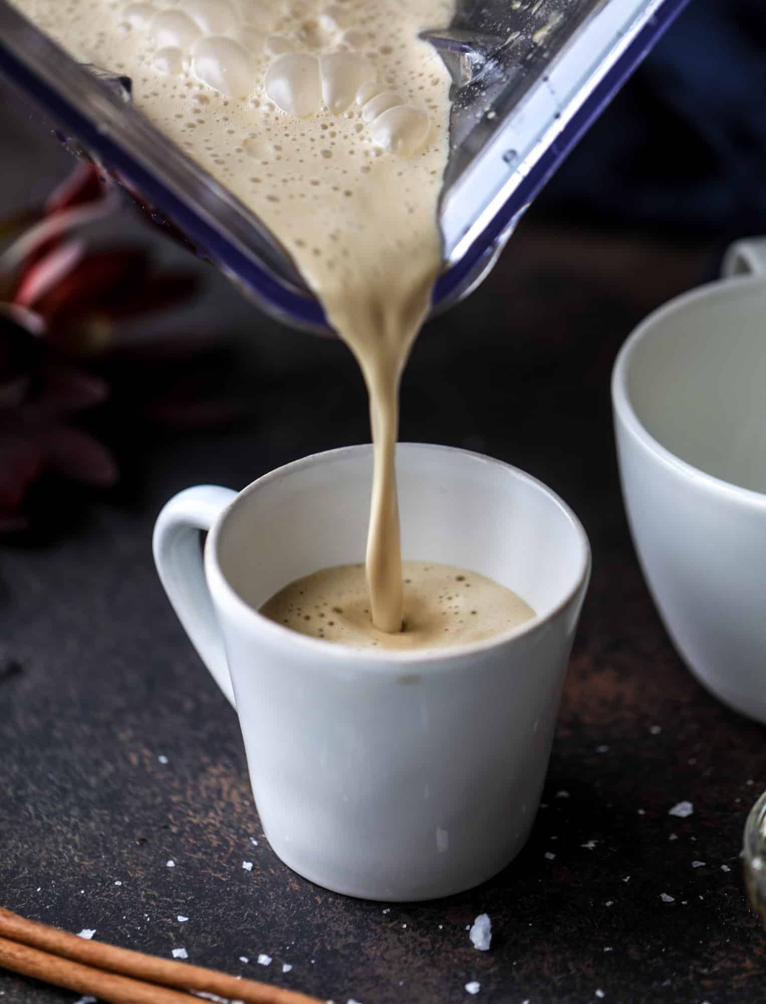 This salted maple power coffee is the perfect creamy pick-me up. Maple syrup, coconut butter and sea salt are blended with hot coffee to make the most deliciously whipped hot, frothy latte-like drink, without any dairy! I howsweeteats.com #coffee #coconutbutter
