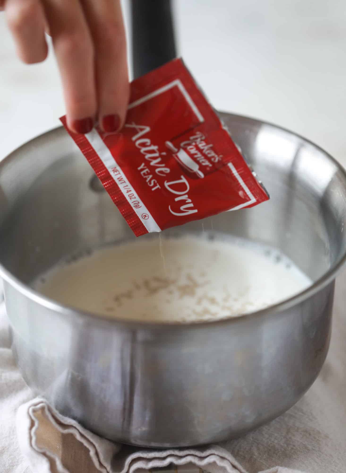 These white chocolate cranberry sticky buns are what holiday dreams are made of! Made in a muffin tin with fresh cranberries and creamy white chocolate, they are drizzled with cranberry caramel too! Dreamy! I howsweeteats.com #sticky #buns