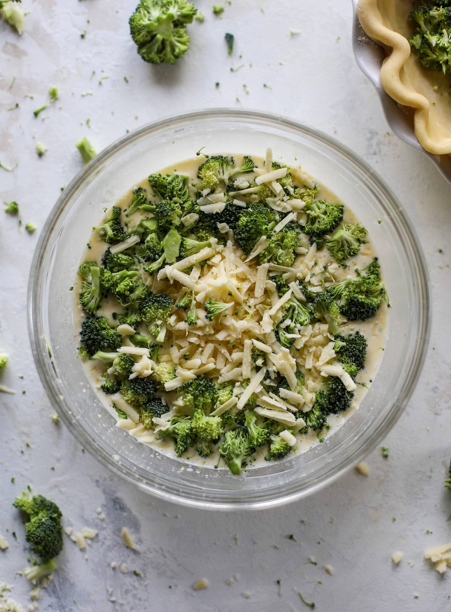 This broccoli cheese quiche is absolutely perfect for brunch, lunch or even dinner! It's delicious served warm or cold, perfect paired with a greens salad and is a recipe that can be made ahead of time! I howsweeteats.com #broccolicheese #quiche