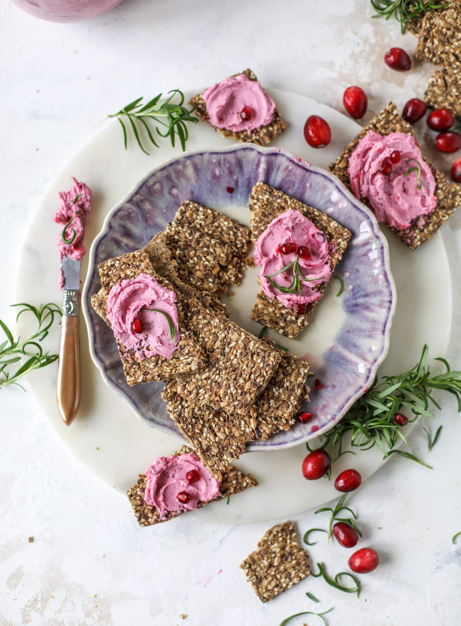 This whipped cranberry goat cheese spread is the perfect holiday appetizer! You can make it ahead of time and serve it with a cheese board or bread and crackers - before or during the meal! Plus it's super pretty too! I howsweeteats.com #cranberry #goatcheese