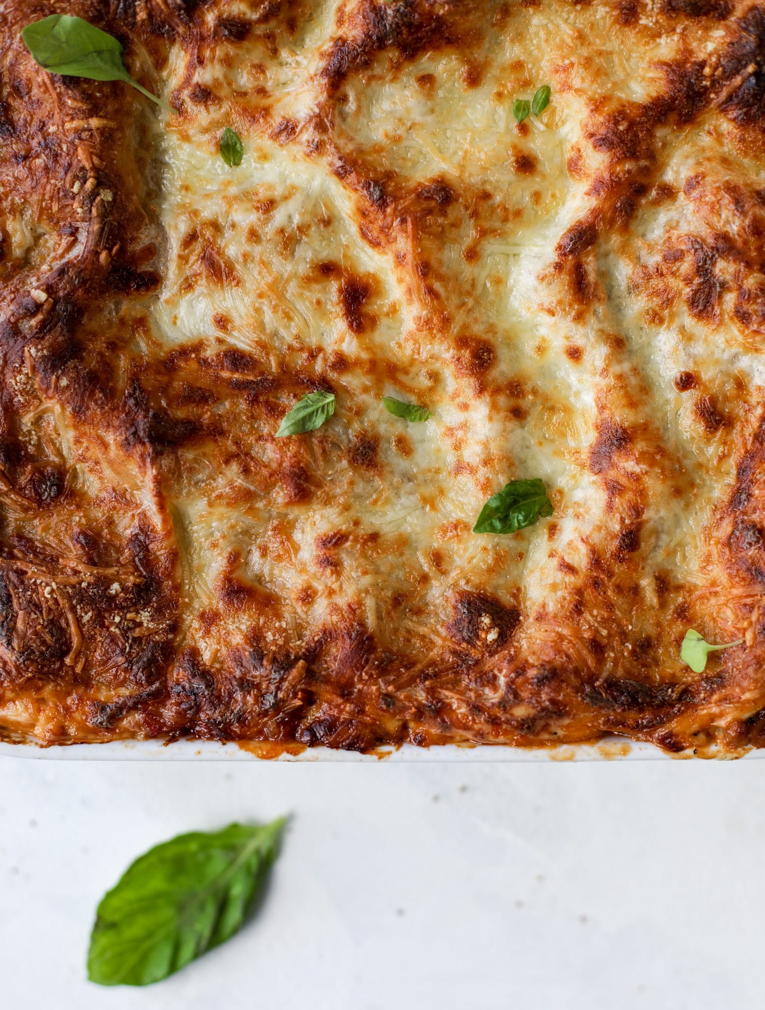 This lasagna bolognese is the ultimate comfort food. Meaty sauce, whole wheat lasagna noodles, creamy bechamel and grated cheese come together to create the most perfect slice of lasagna heaven! I howsweeteats.com #lasagna #bolognese