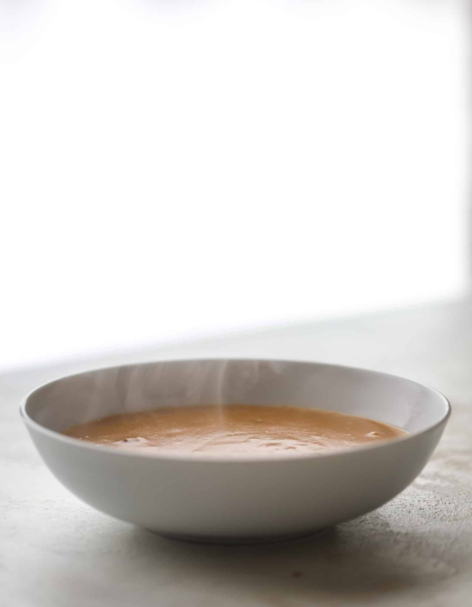 This lobster bisque recipe is delicious, easy and always a crowd pleaser! It's so simple to make at home and it's a rich, decadent treat to serve your family. I also show you how to make a lobster cappuccino, which is lobster bisque with foamed cream! I howsweeteats.com #lobster #bisque