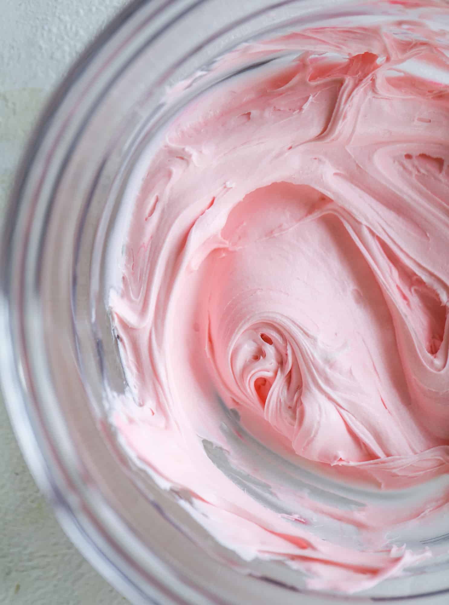 This pink peppermint cake is festive and delicious for the holidays! Layers of vanilla cake frosting with peppermint cream cheese frosting, covered in sparkly sugar and peppermint meringues. Couldn't be cuter! I #pinkpeppermint #cake