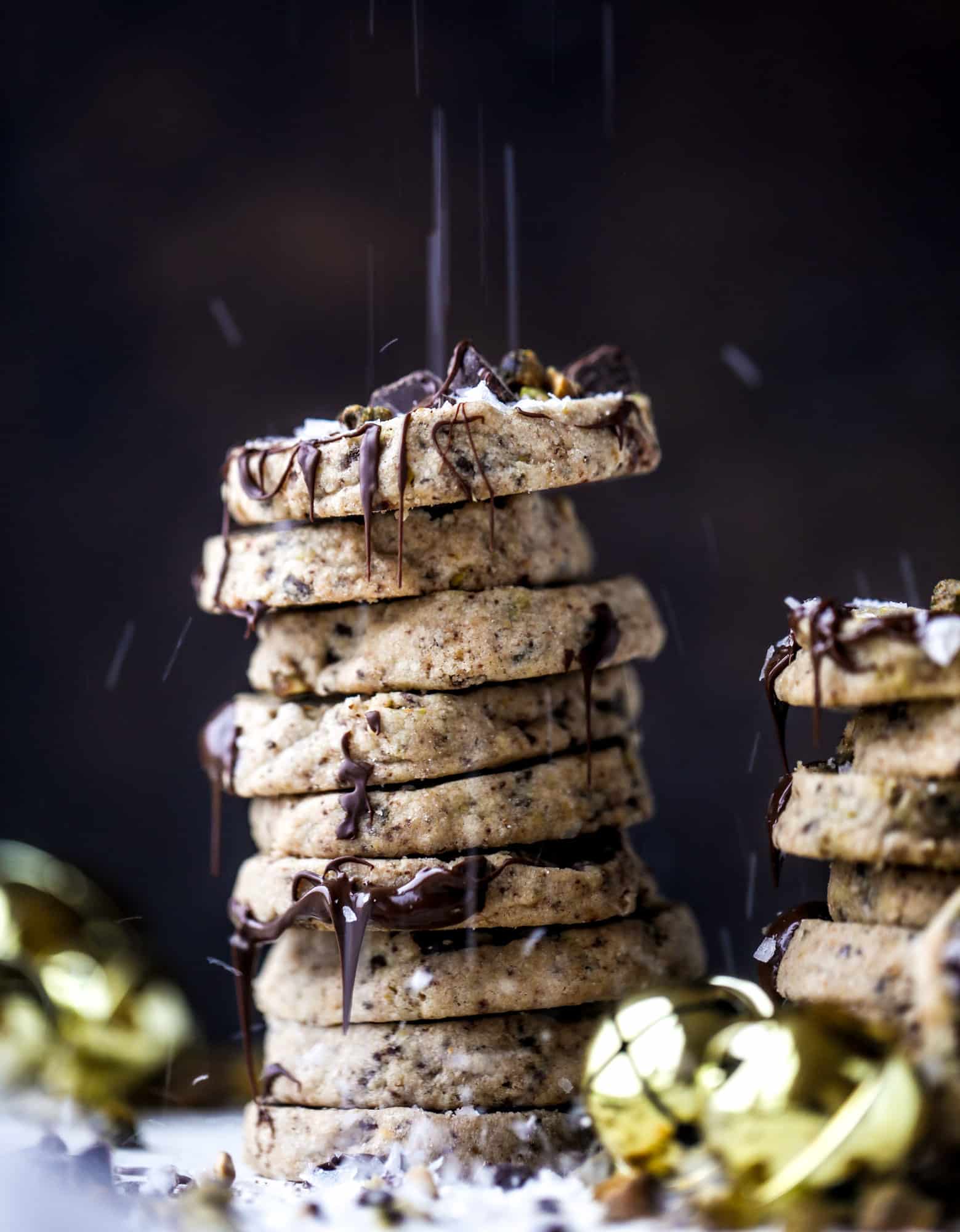 This chocolate pistachio shortbread recipe is the perfect combo of sweet and salty in a crunchy cookie! Melty, rich dark chocolate comes together with roasted, salted pistachios to make a delicious crunchy cookie! I howsweeteats.com #chocolate #pistachio #shortbread