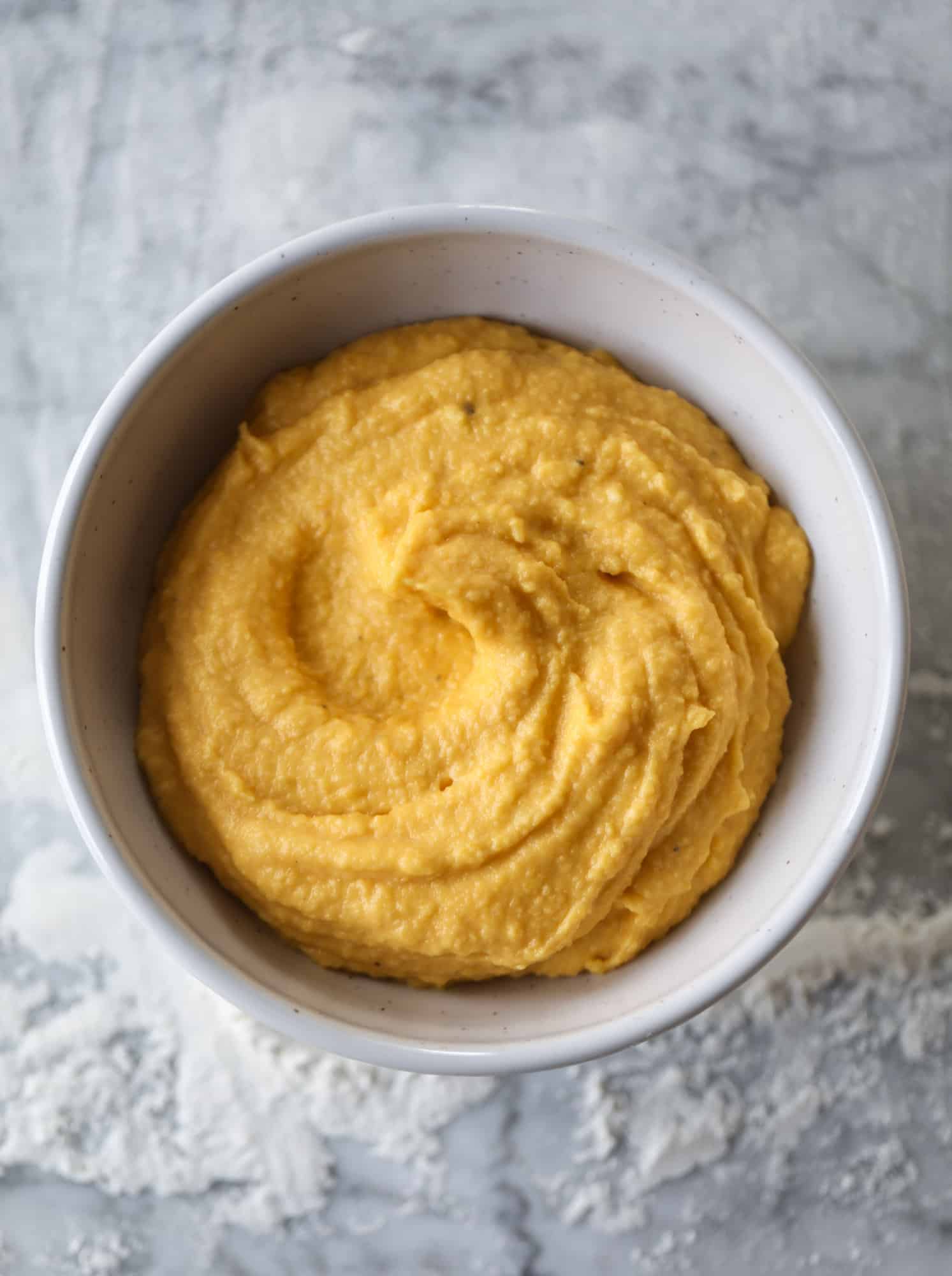 This butternut squash pizza has all the perfect tastes of fall in a pizza! Creamy butternut squash base, sharp parmesan cheese, crispy, fresh sage - it's all these and so super flavorful. It's easy too! I howsweeteats.com #butternutsquash #pizza