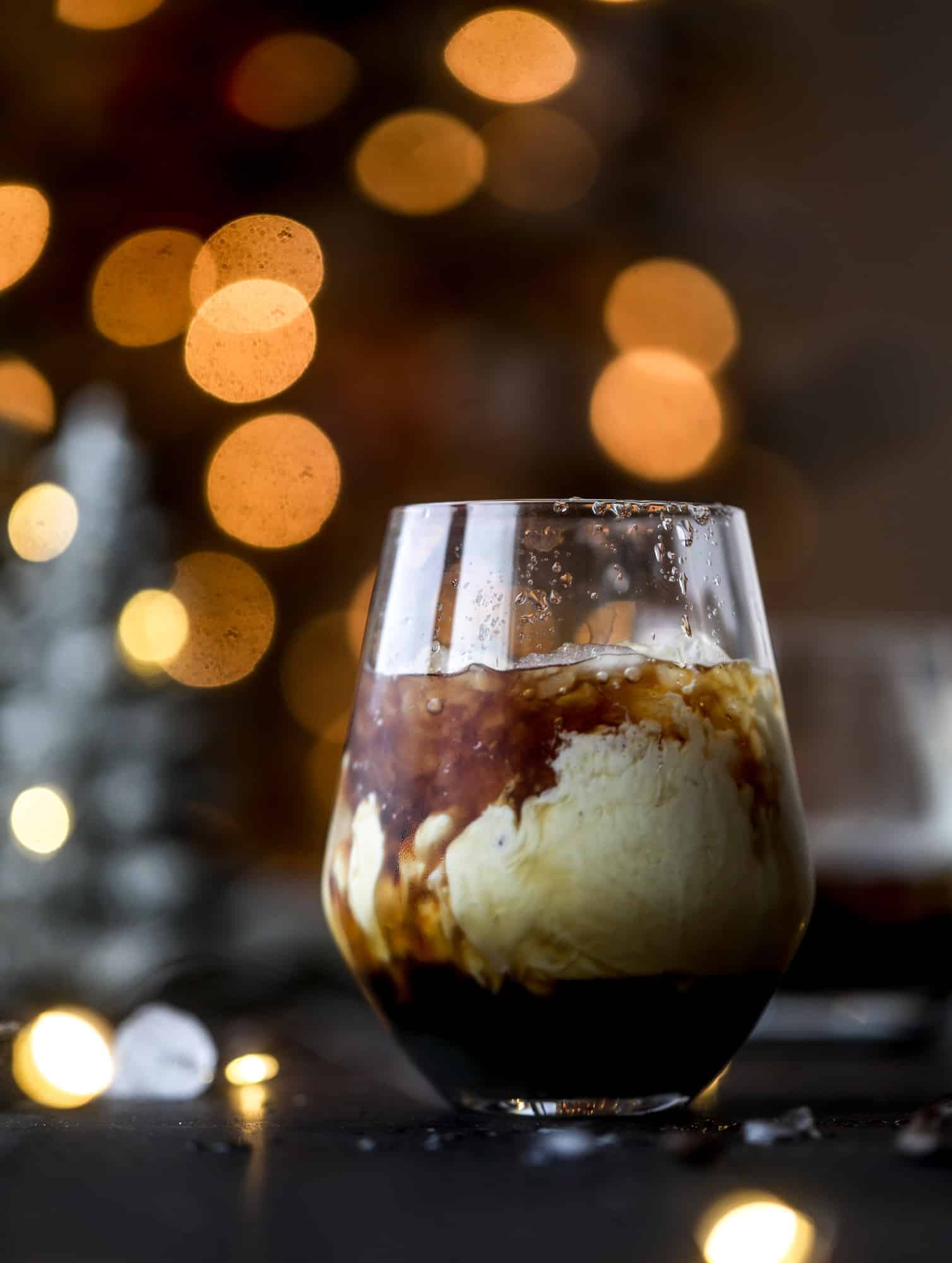 The eggnog white russian cocktail is perfect for the holiday season! Coffee liqueur mixed with vanilla vodka and eggnog and topped with freshly grated nutmeg is the perfect treat and oh-so festive! I howsweeteats.com #eggnog #whiterussian