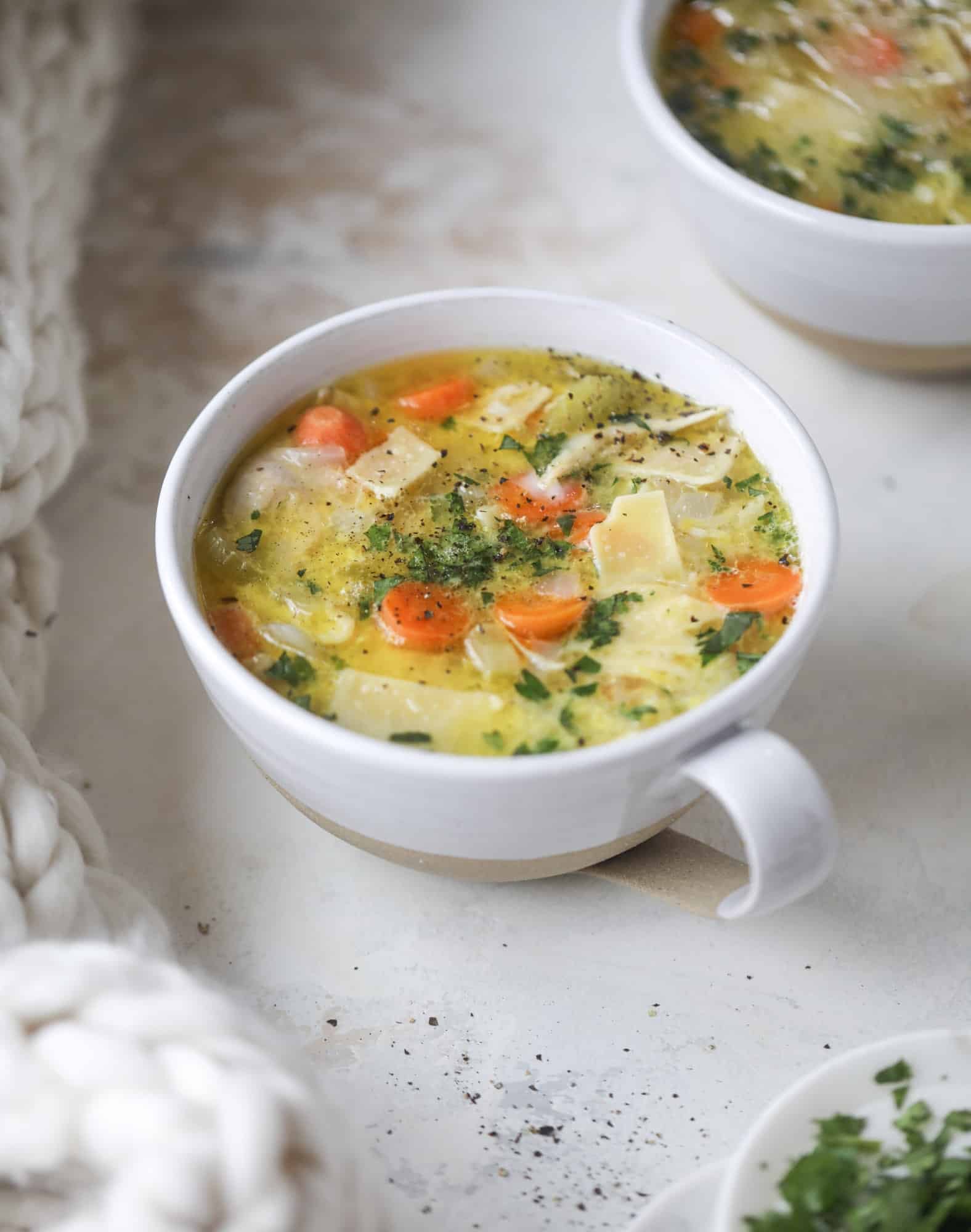 This chicken noodle egg drop soup is the ultimate comfort food! Homemade stock and satisfying ingredients provide the best nourishment and comfort! I howsweeteats.com #chicken #noodlesoup